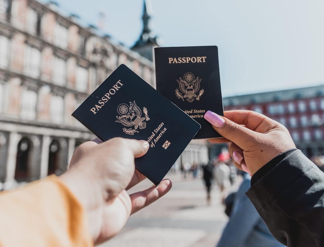 Travellers holding their passports — global mobility through a second citizenship